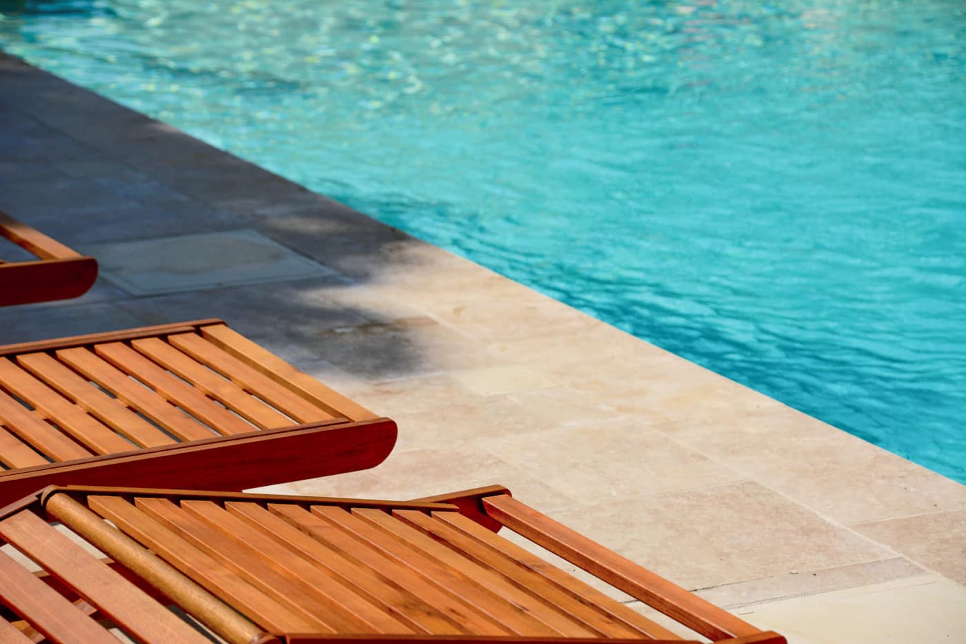 Deck beside a swimming pool where water resistance matters
