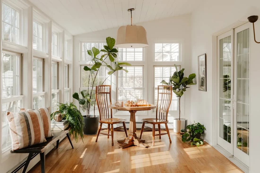 Four-season sunroom with insulated glass and furniture