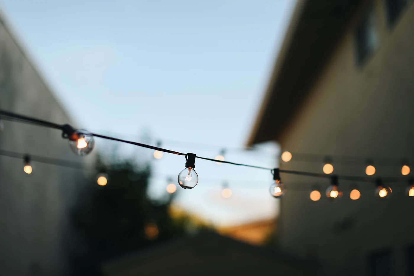 Cozy deck lit with string lights in the evening