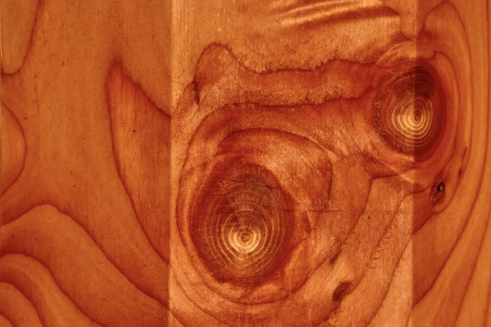 Close-up of warm, richly grained natural cedar-tone wood showing tight, knot-free lines