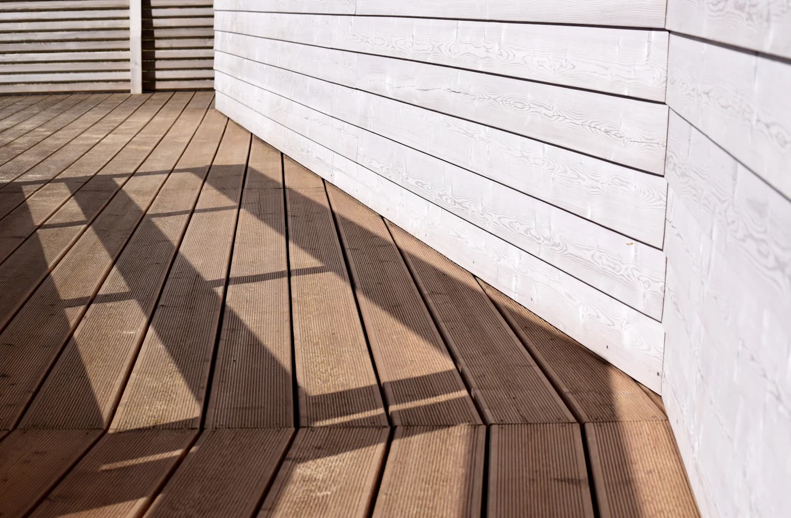 A freshly sealed wooden deck showing a clean, natural finish with visible grain