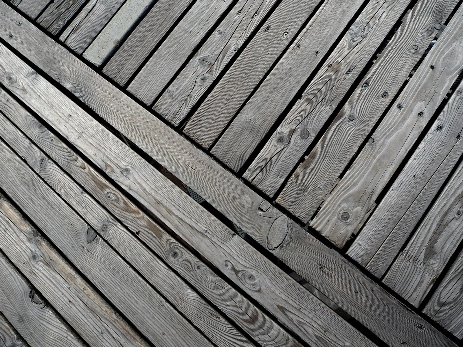 Close-up of evenly spaced deck boards with a consistent narrow gap between each board