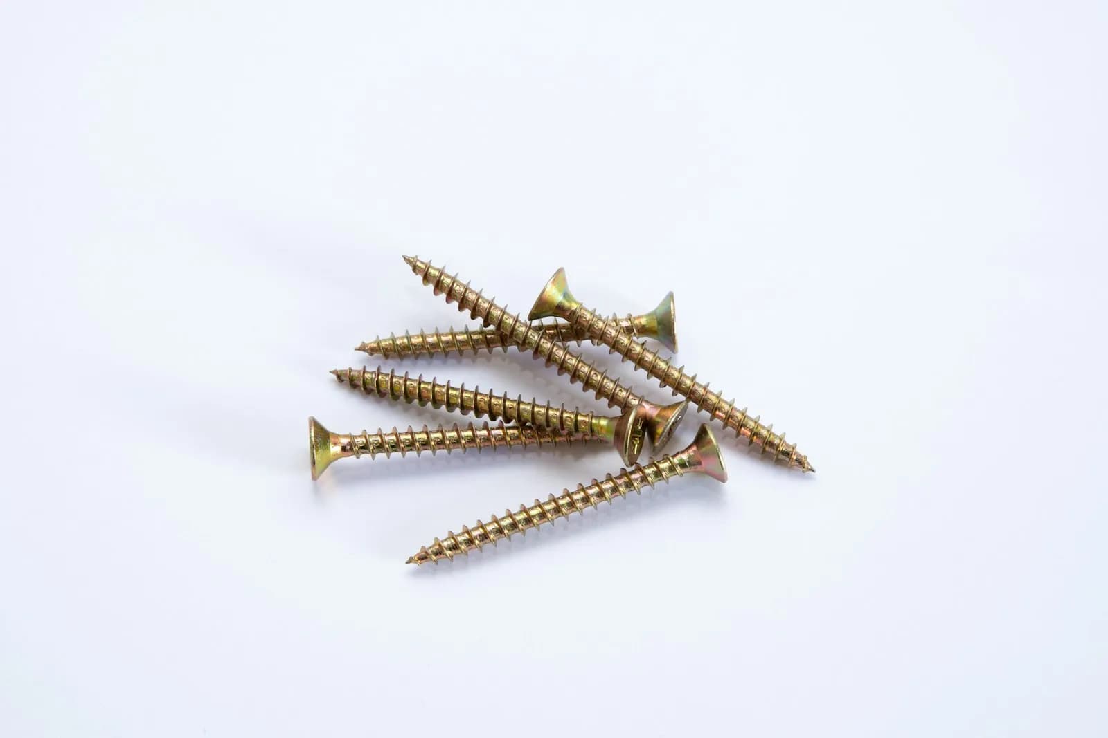 Deck screws and hidden fastener clips used to secure deck boards to the joists