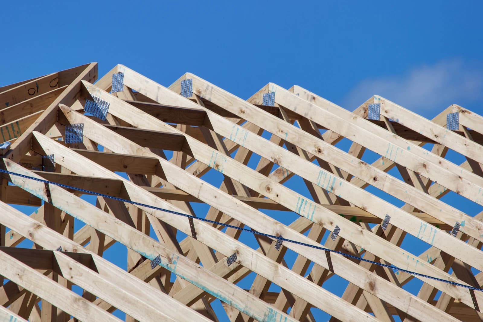 A partially built wooden deck structure framed against the sky