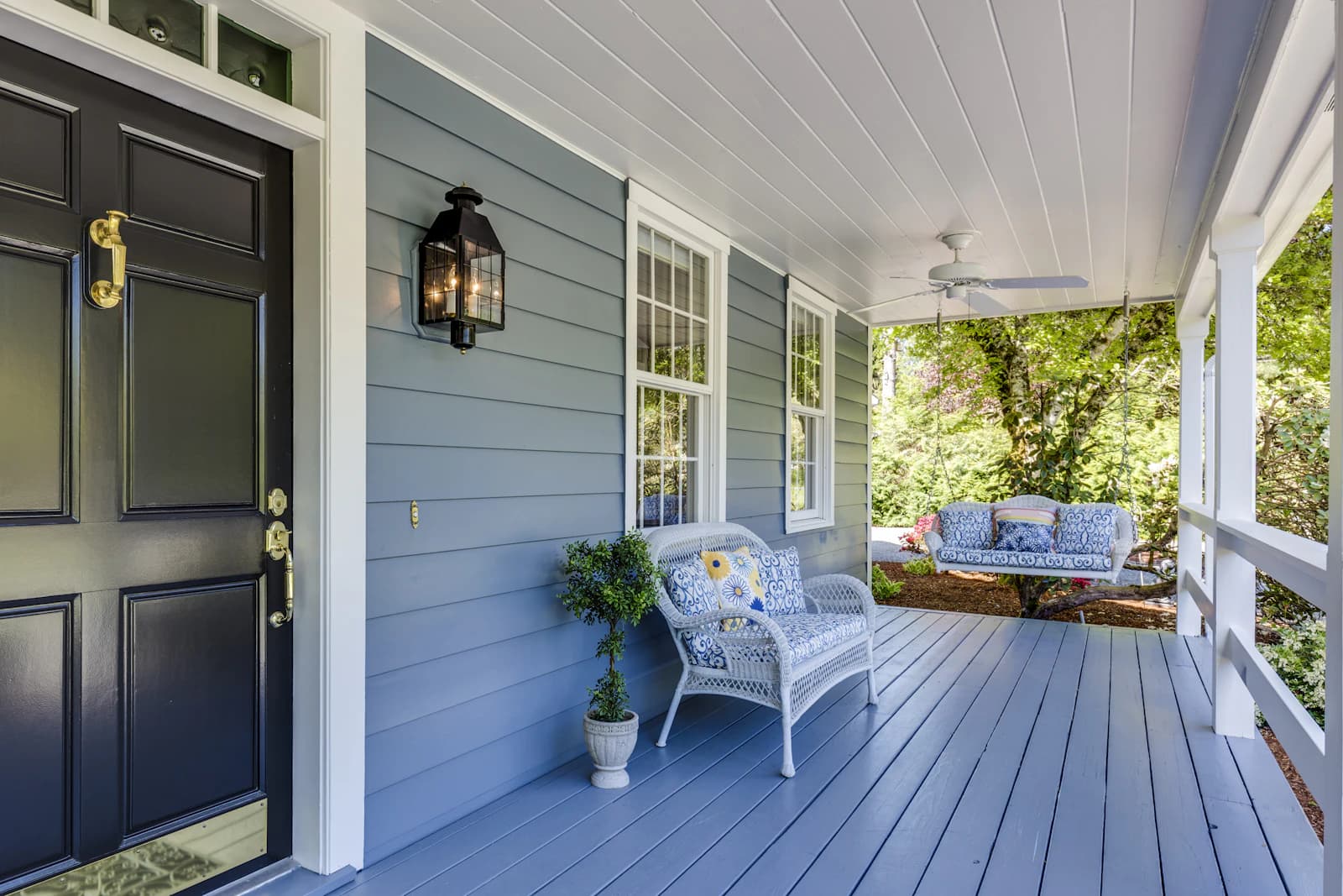 A wooden deck finished with solid opaque paint in a uniform color