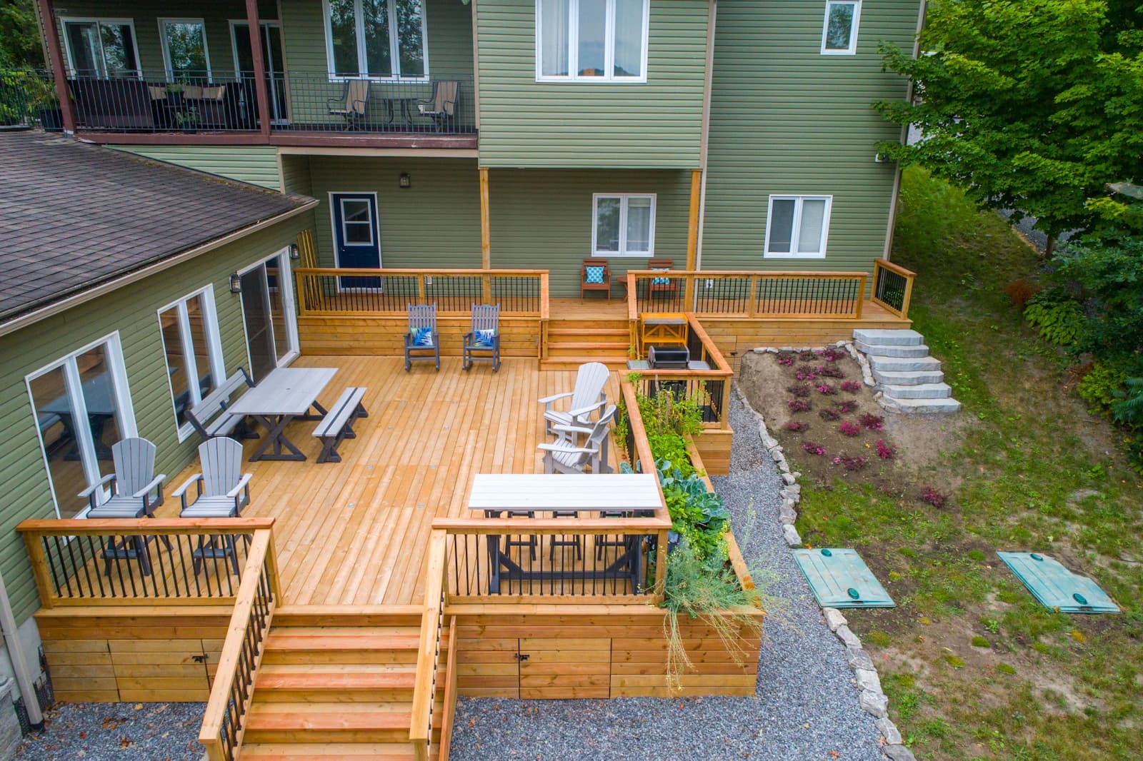 A compact backyard deck sized around 10 by 10 feet with a small bistro set