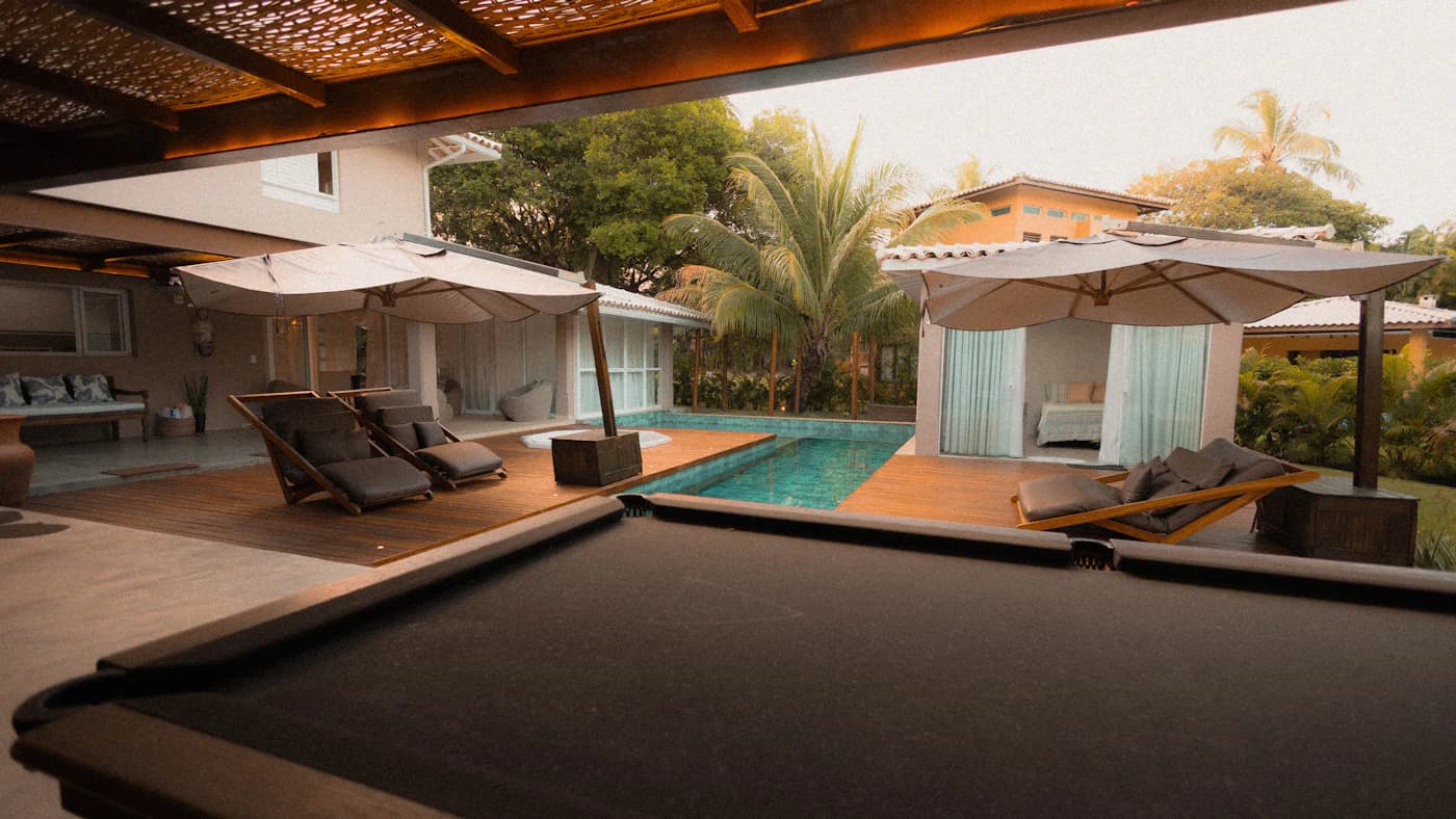 Backyard composite deck at sunset with outdoor furniture