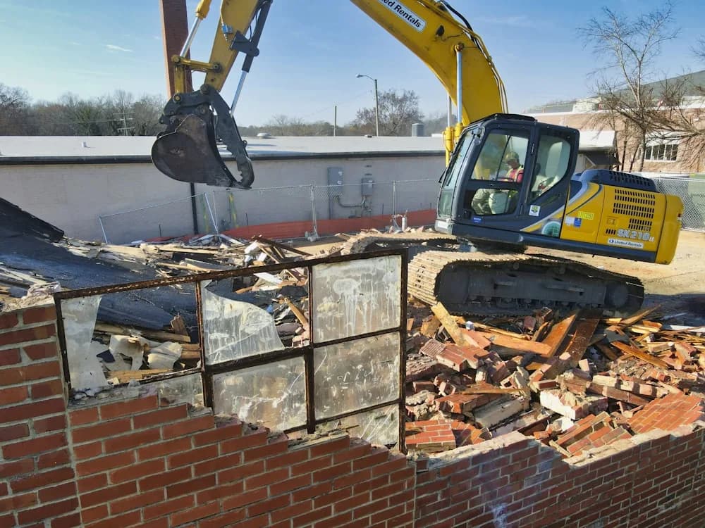 Deck being torn out with debris hauled to a dumpster
