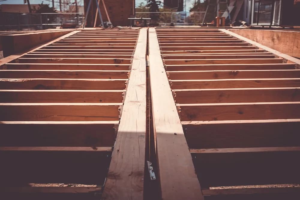 Exposed sound deck frame of joists and beams that can be reused