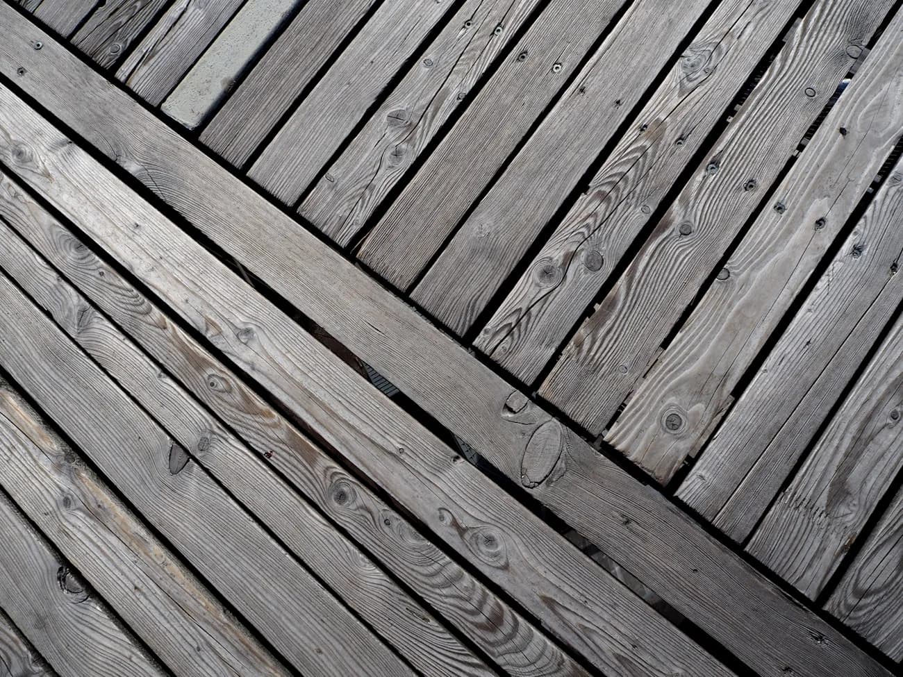 Old, weathered gray deck boards due for replacement