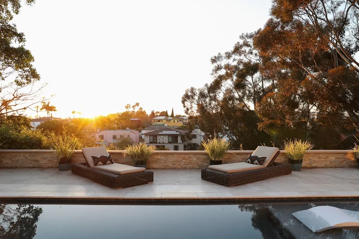 Elevated second-story deck at dusk overlooking a backyard